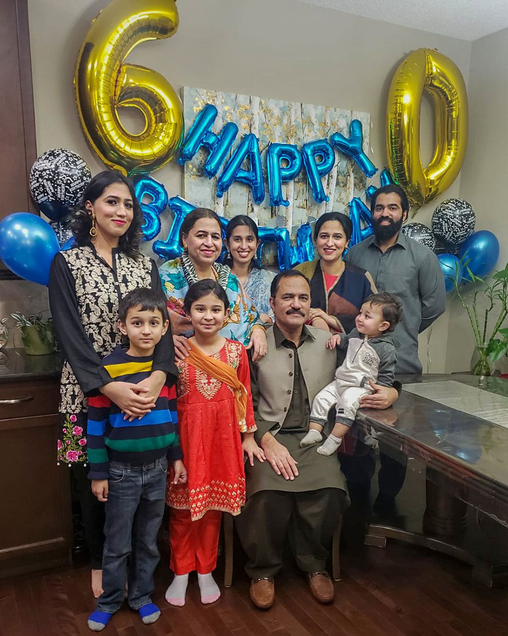 Mirza Attaullah, Surmont site services coordinator, celebrates with his family on his 60th birthday.