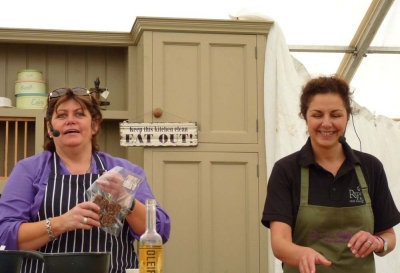 Jane cooking new Premium Black Pudding with Chef, Rachel Green