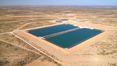 A pond filled with recycling produced water at China Draw in the arid Permian Basin. 